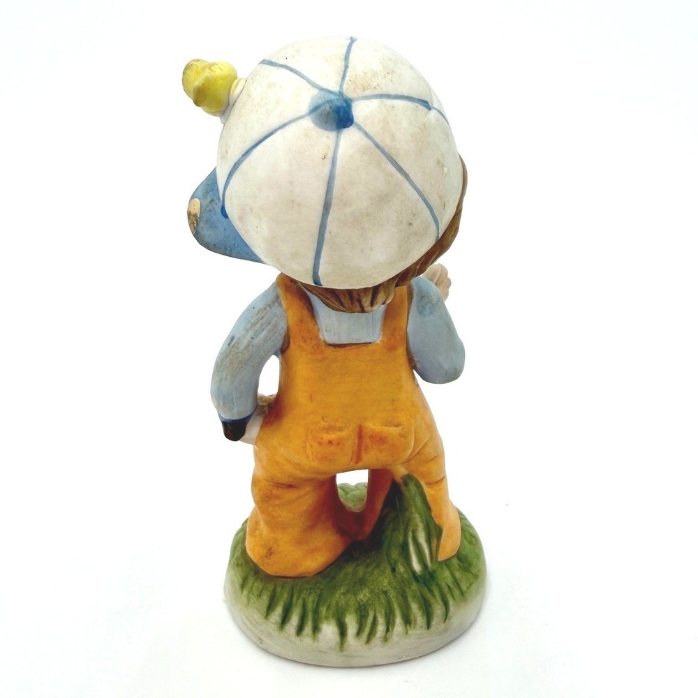 Vintage Bisque Porcelain Boy Figurine Slingshot Bird Hat Orange Overalls - Picture 3 of 6